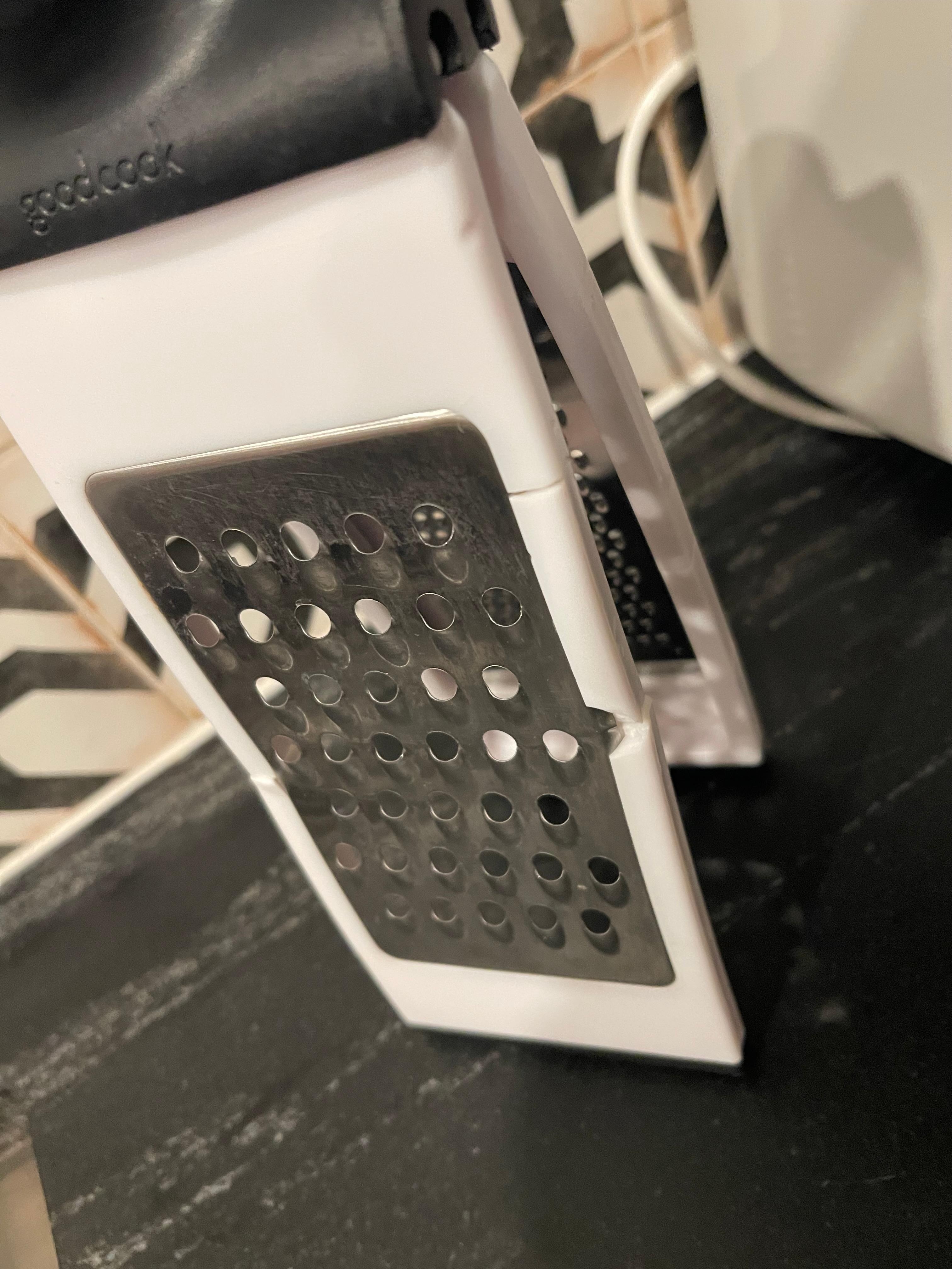 Broken dirty cheese grater