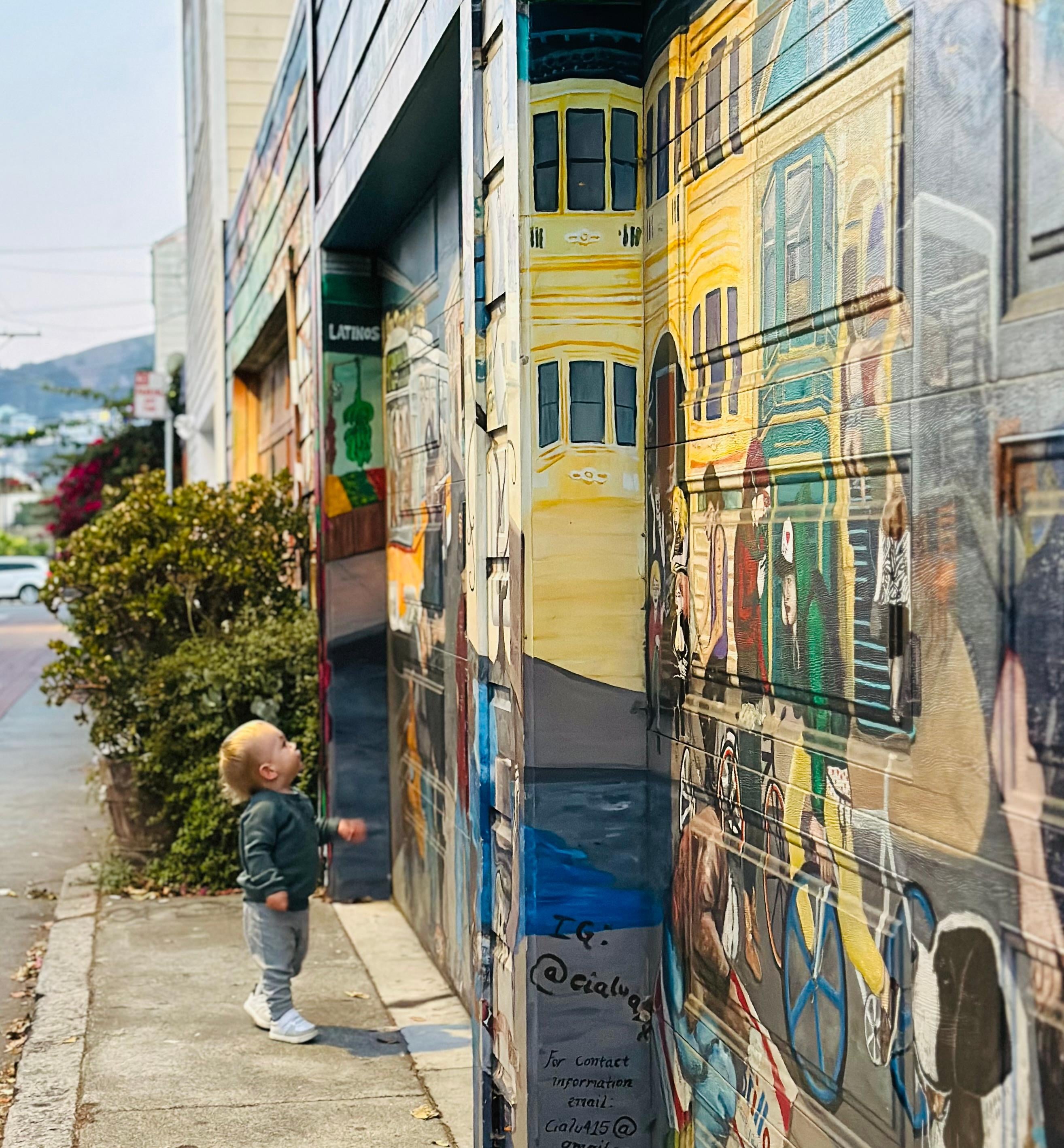 My grandson enjoying some Mission District Street Art.