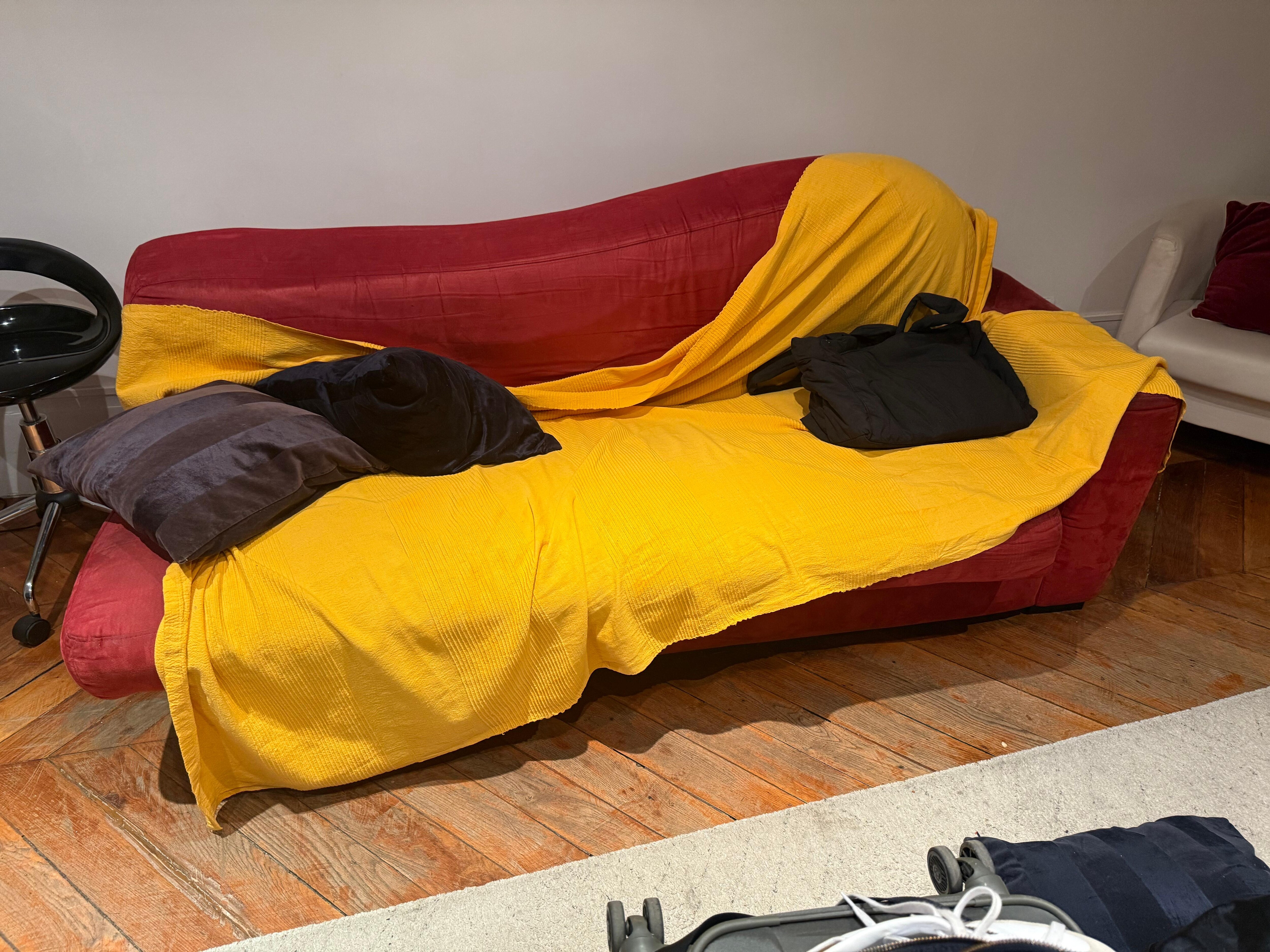 Covered with a worn stained blanket and bed underneath wouldn’t properly store