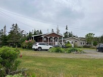 the white car is in front of the cottage at which we stayed. There are other cottages nearby.
