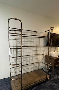 Metal clothing rack not properly anchored