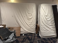 On a floor in the middle of the hallway