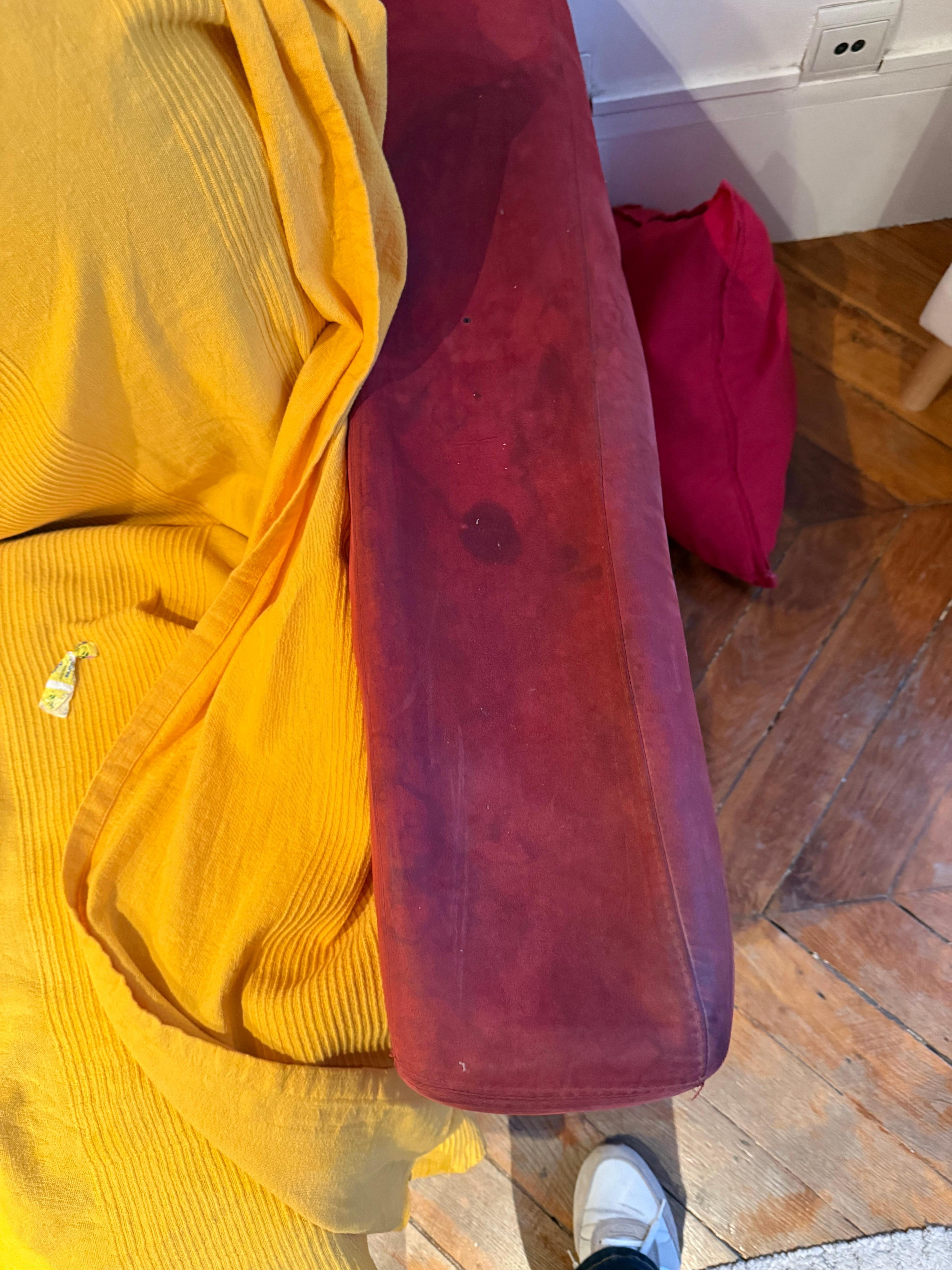 Stained, very worn couch