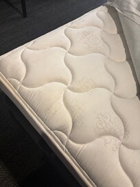 Small black stains all over mattress