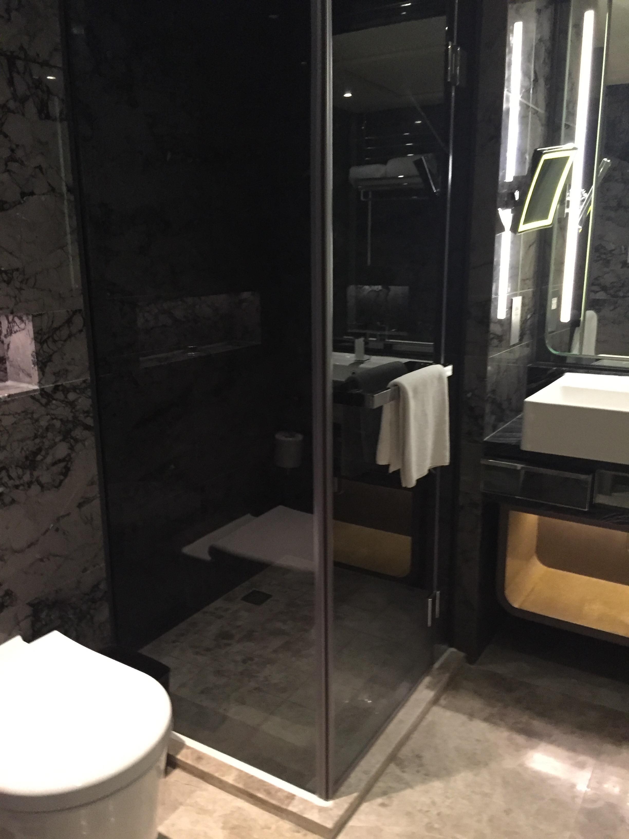 Large bathtub with curtains that can open/close for view of room (and TV during your bath)