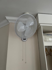 A wall mounted fanâŠ.