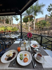 Breakfast with a view to a waterfall