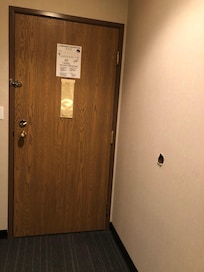 Hole in wall from door handle complete with door handle inside wall