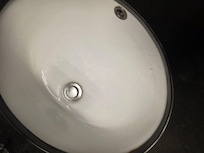 Coffee and hair in sink.