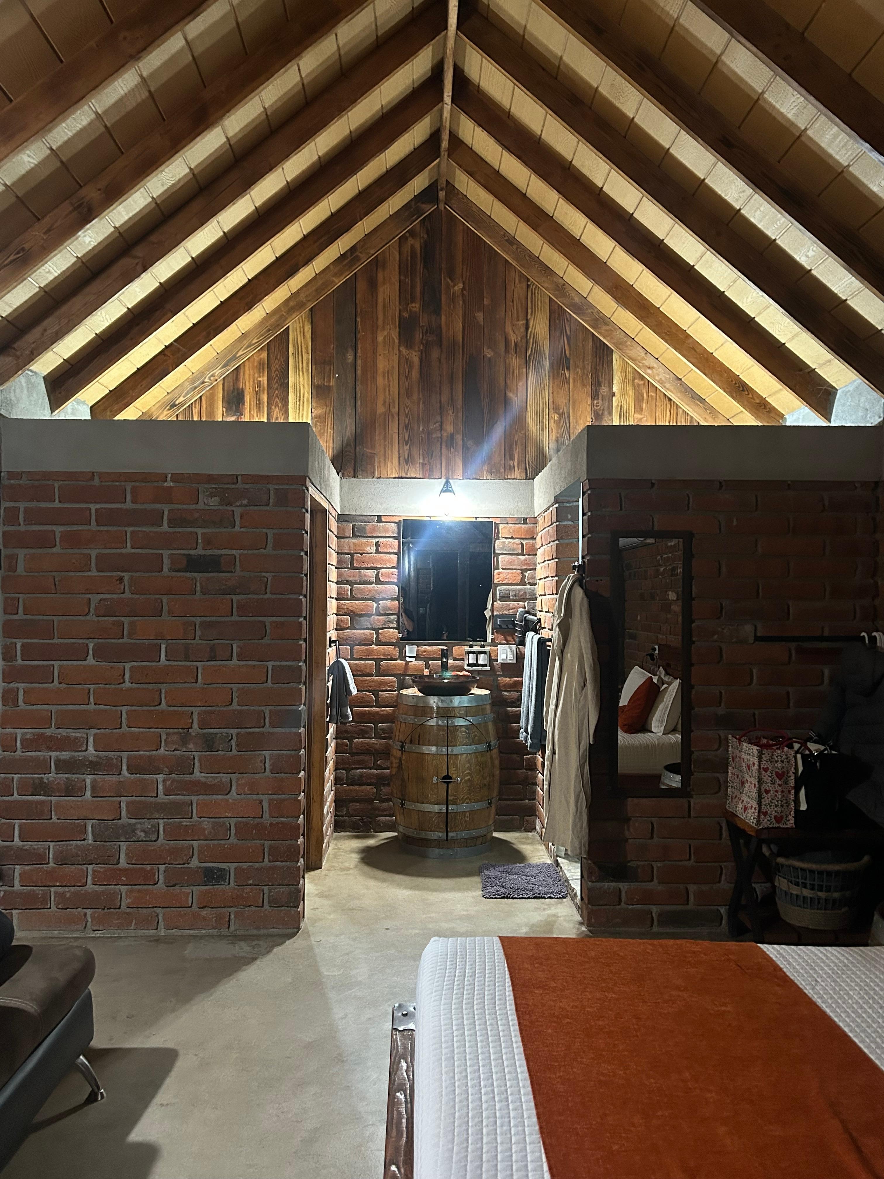 Cabin liking to the left toilet room, middle sink, and right shower.