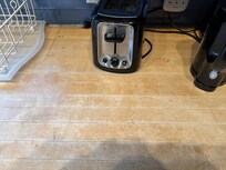 Burn and marks on the kitchen counter.