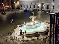 View of one of the fountains at night outside our window.