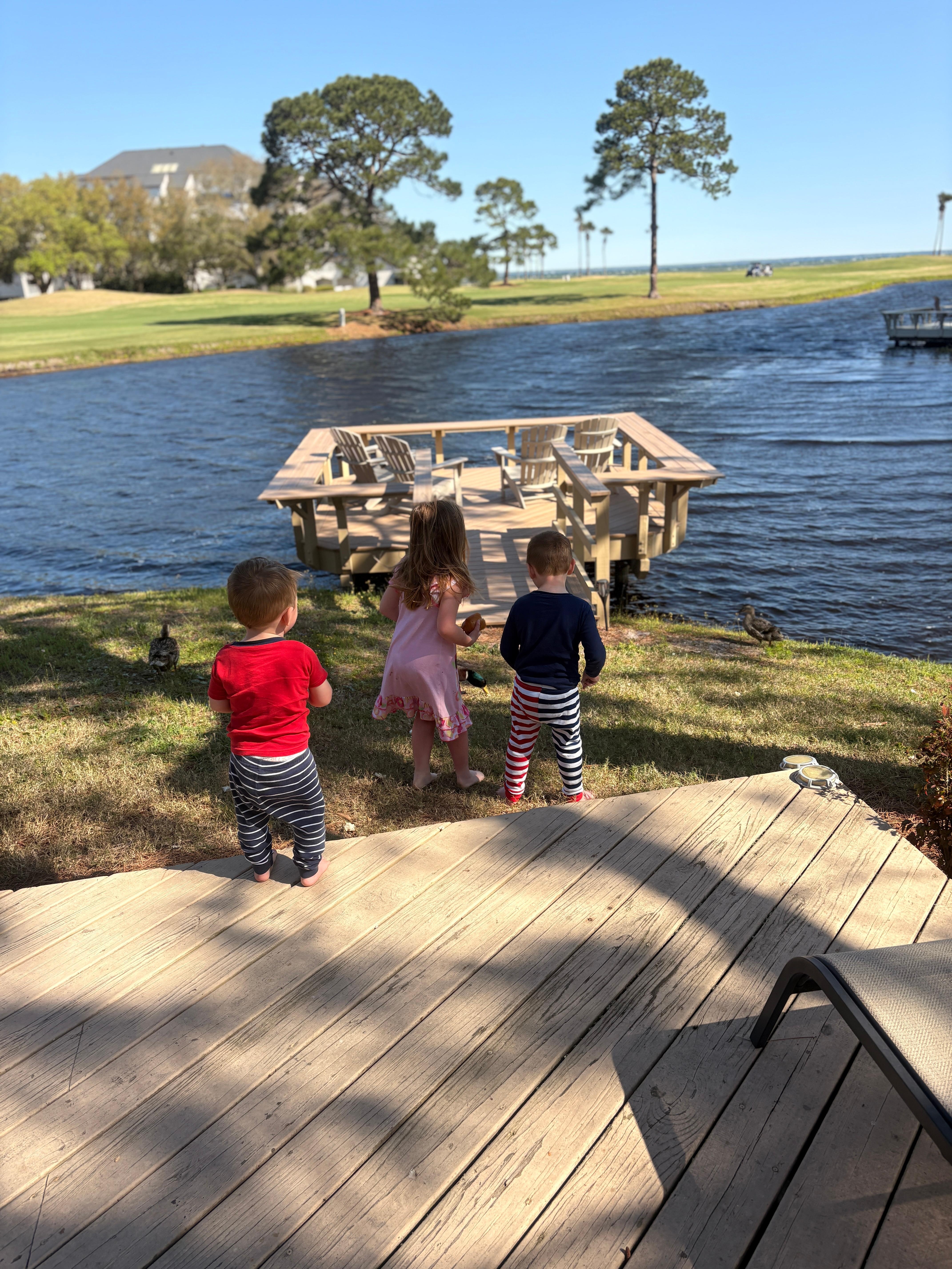 On the deck in back of unit