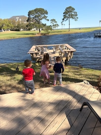 On the deck in back of unit