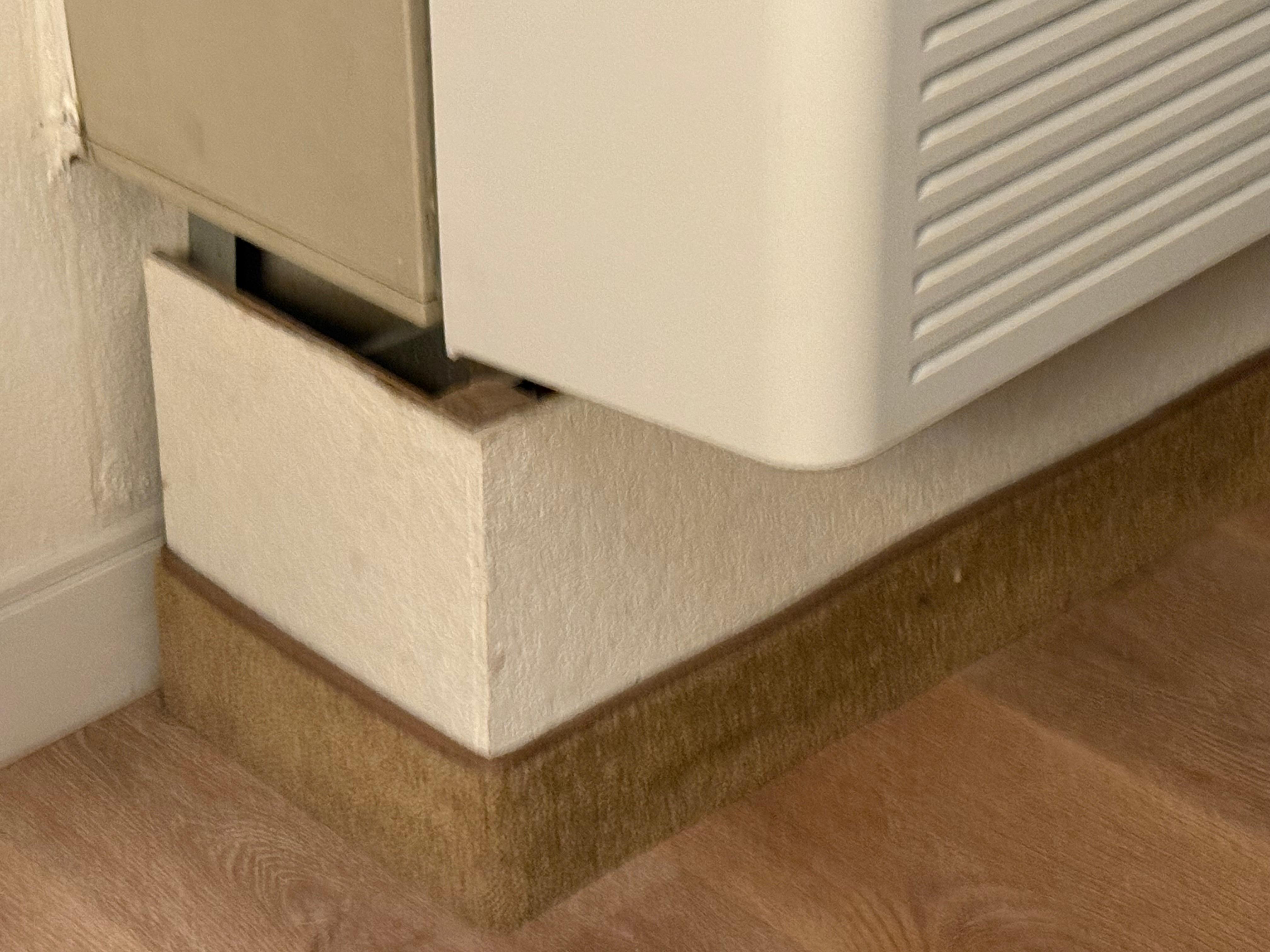 Gap between air conditioner and the board. 