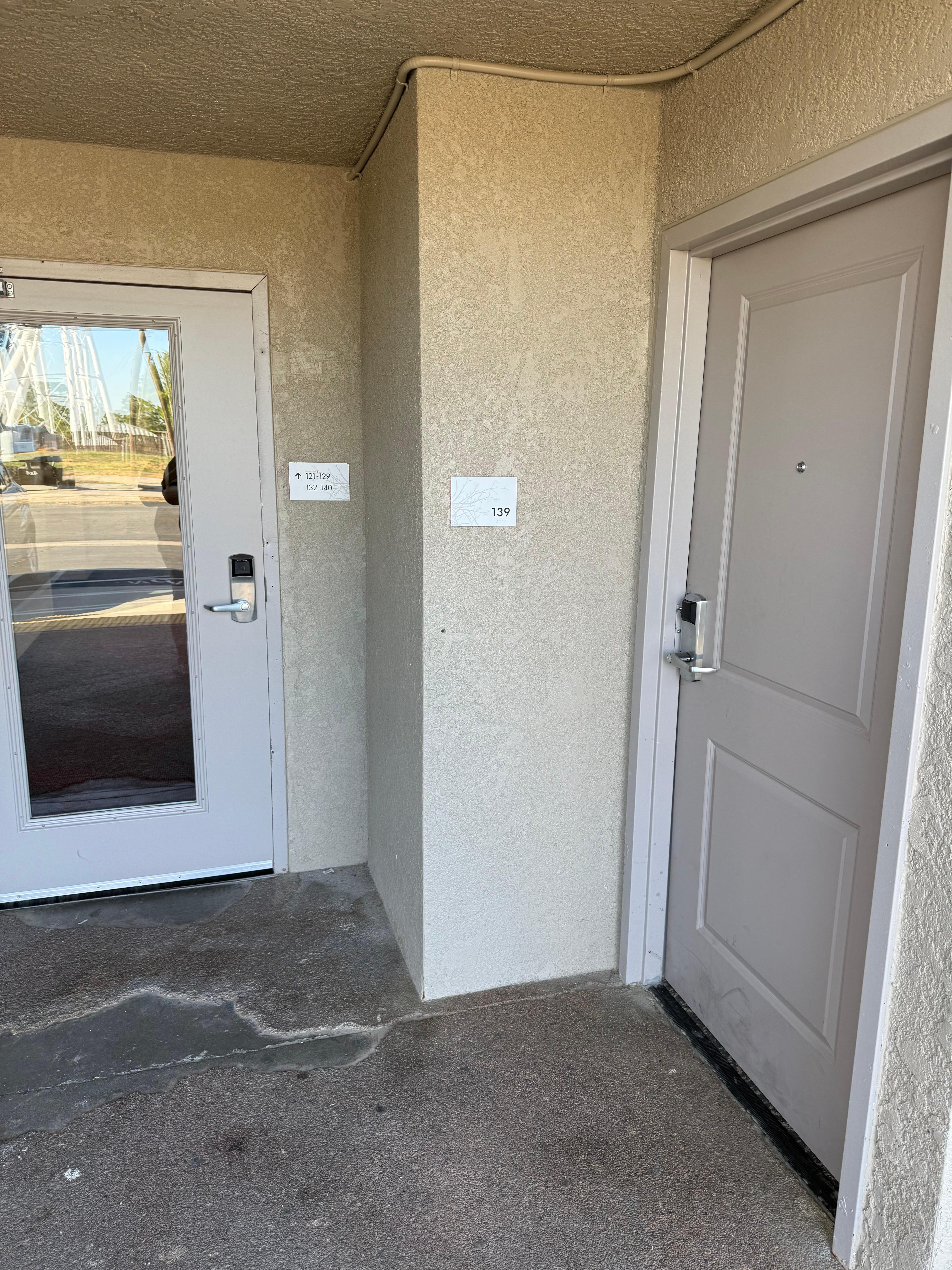 This room is OUTSIDE of the external door leading to other rooms.  