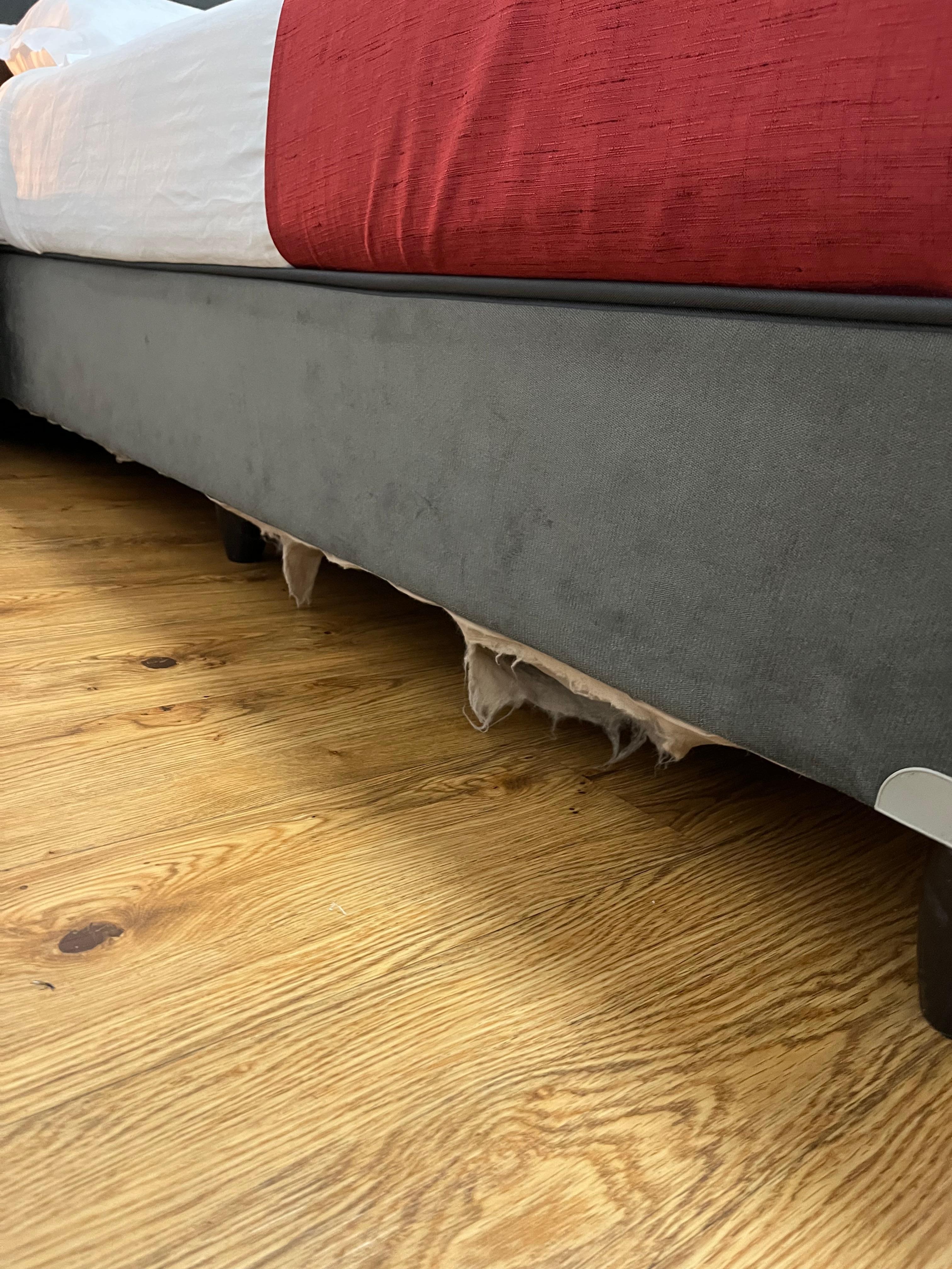Torn bed upholstery 