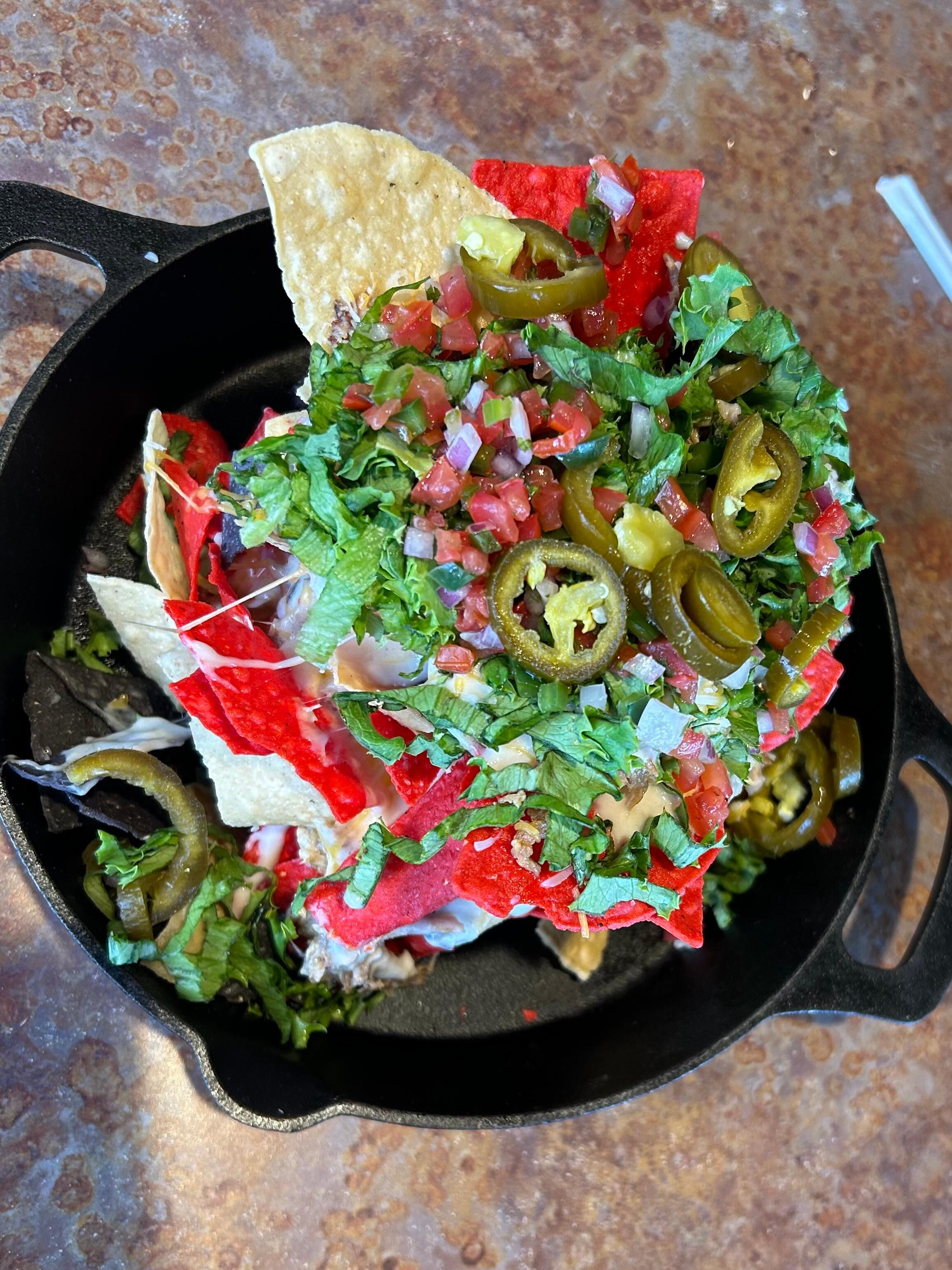 Trash Nachos were served differently and were good. 