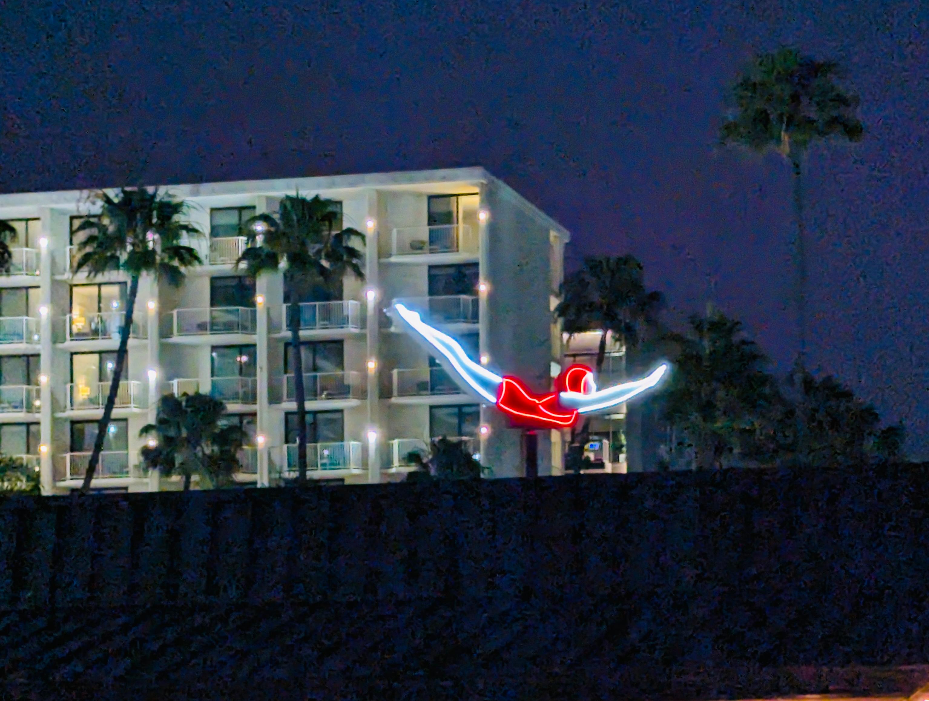 Iconic rotating diver near pool