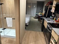 King bed kitchenette room 416 main floor with outside patio.