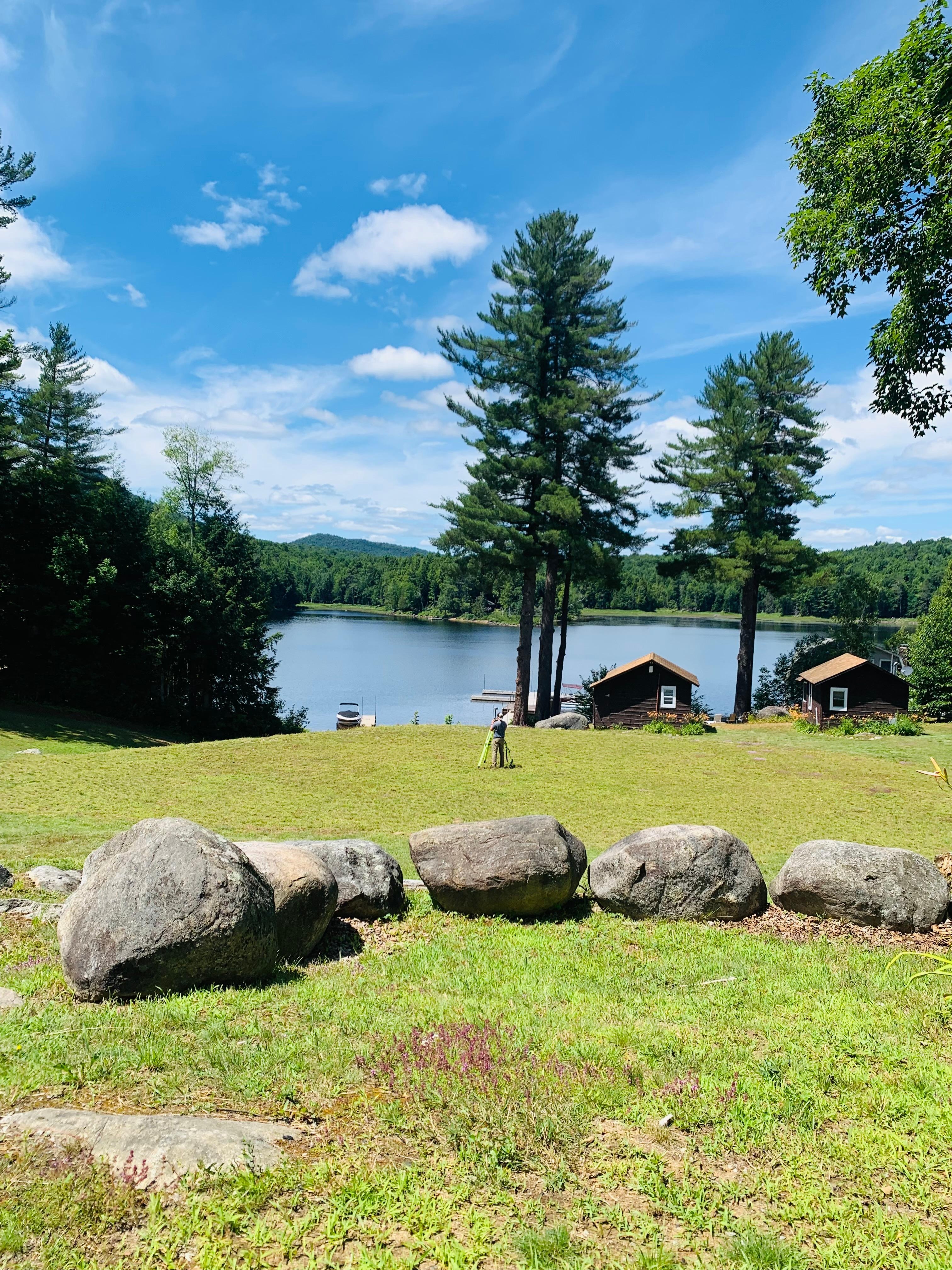 Relaxing in Adirondack chairs looking at the lake.