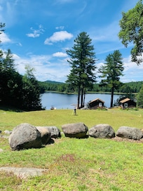 Relaxing in Adirondack chairs looking at the lake.