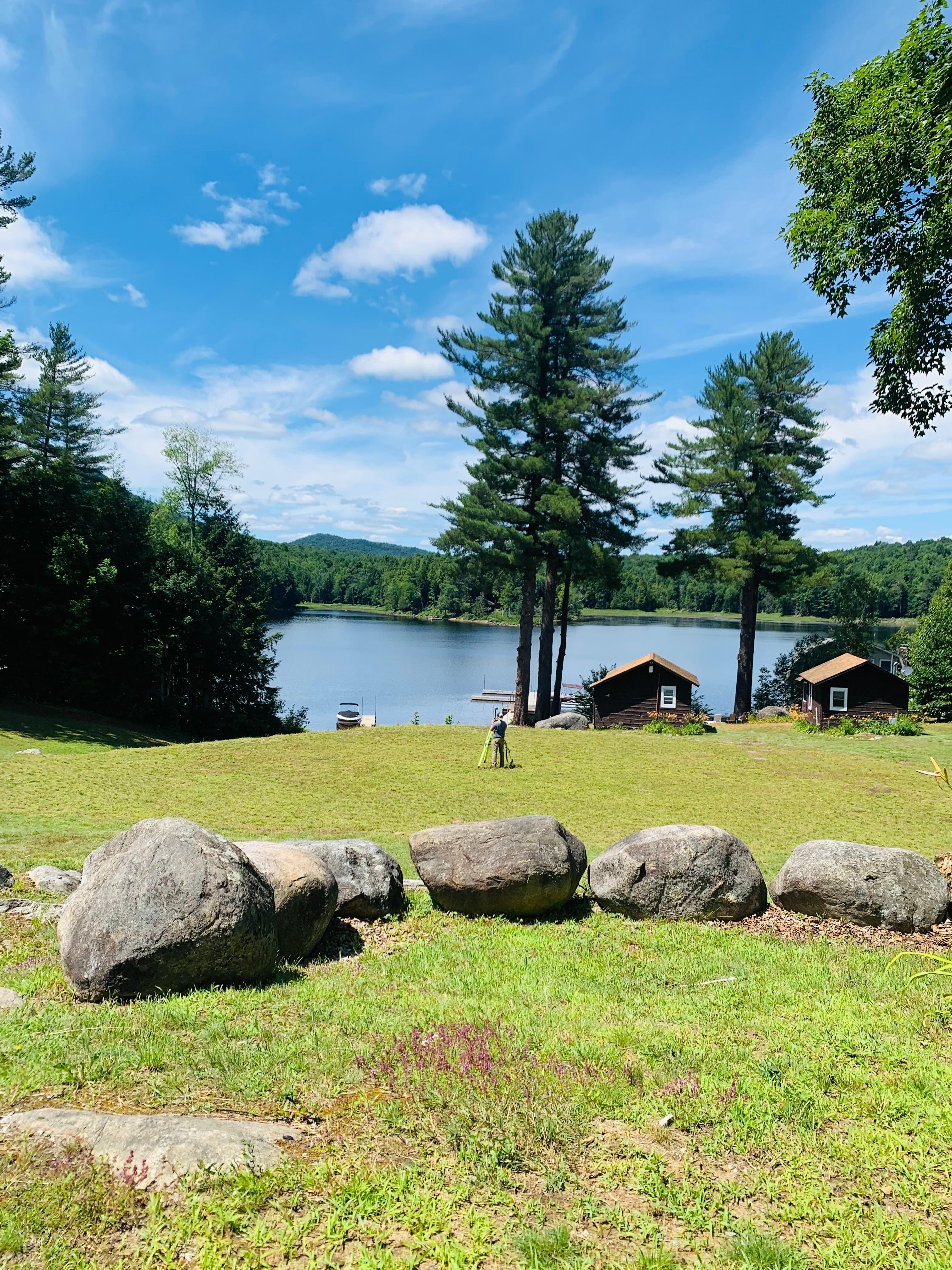 Relaxing in Adirondack chairs looking at the lake.