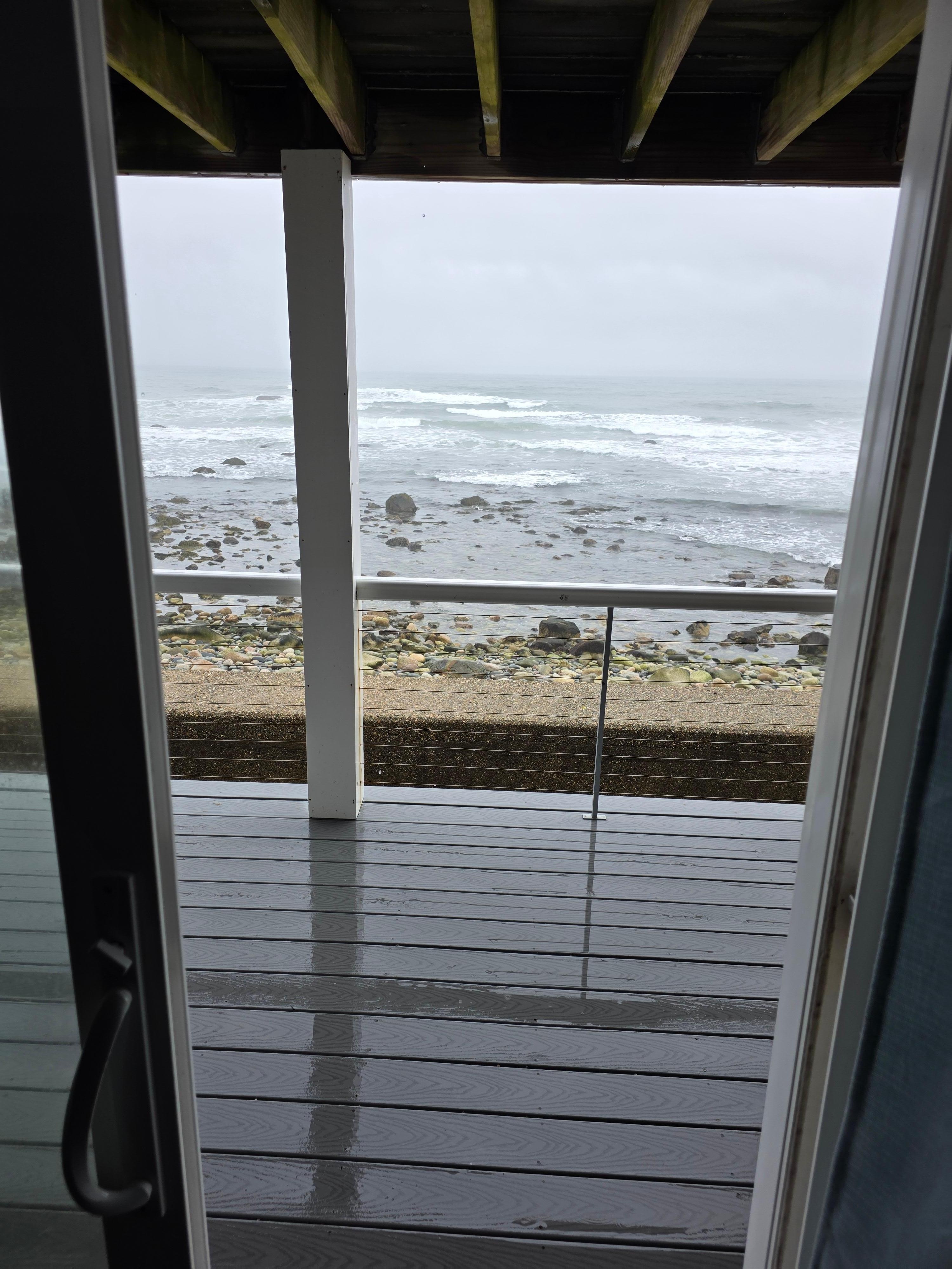 Literally oceanfront. Waves splash up above wall at high tide. 