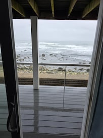 Literally oceanfront. Waves splash up above wall at high tide.