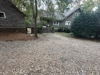 Front exterior with circle drive.