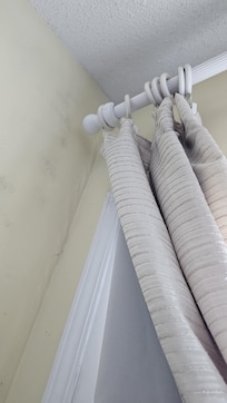 Mold on the bottom of the curtain and the curtain being held in place which seems to be part of the problem.