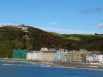 The hotel (light blue) taken from the pier