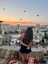 Enjoying the hot air balloons from hotel terrace.