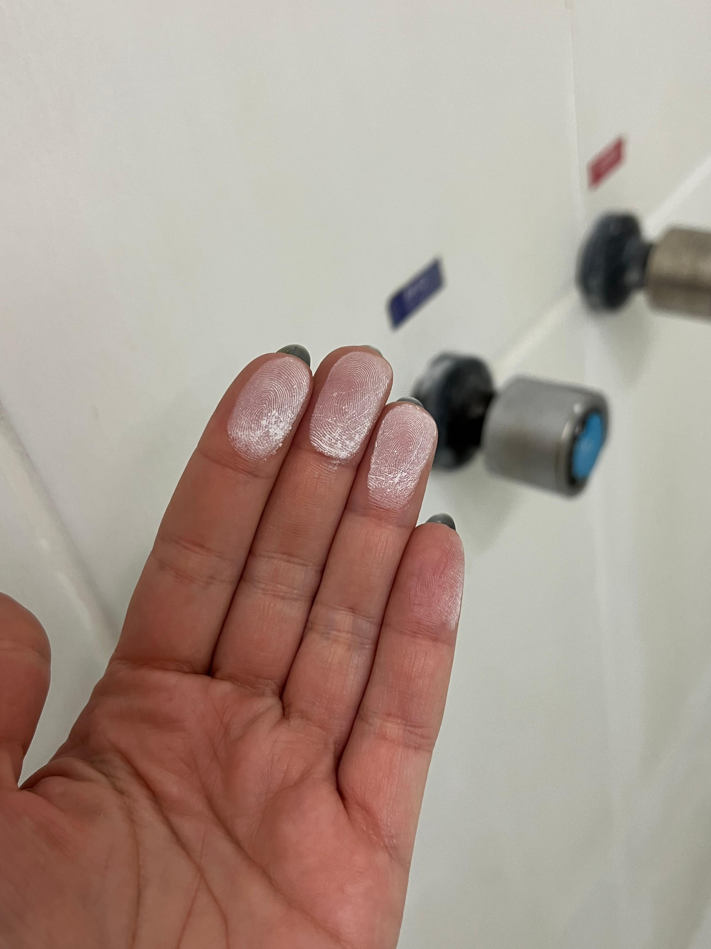 Shower wall with decades of accumulated grime.