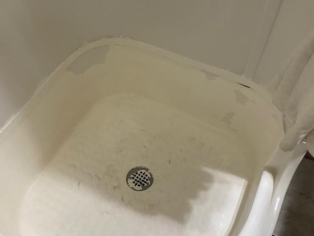 Shower in need of repair and a cleaning.