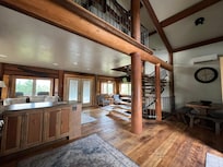 Standing at kitchen sink.