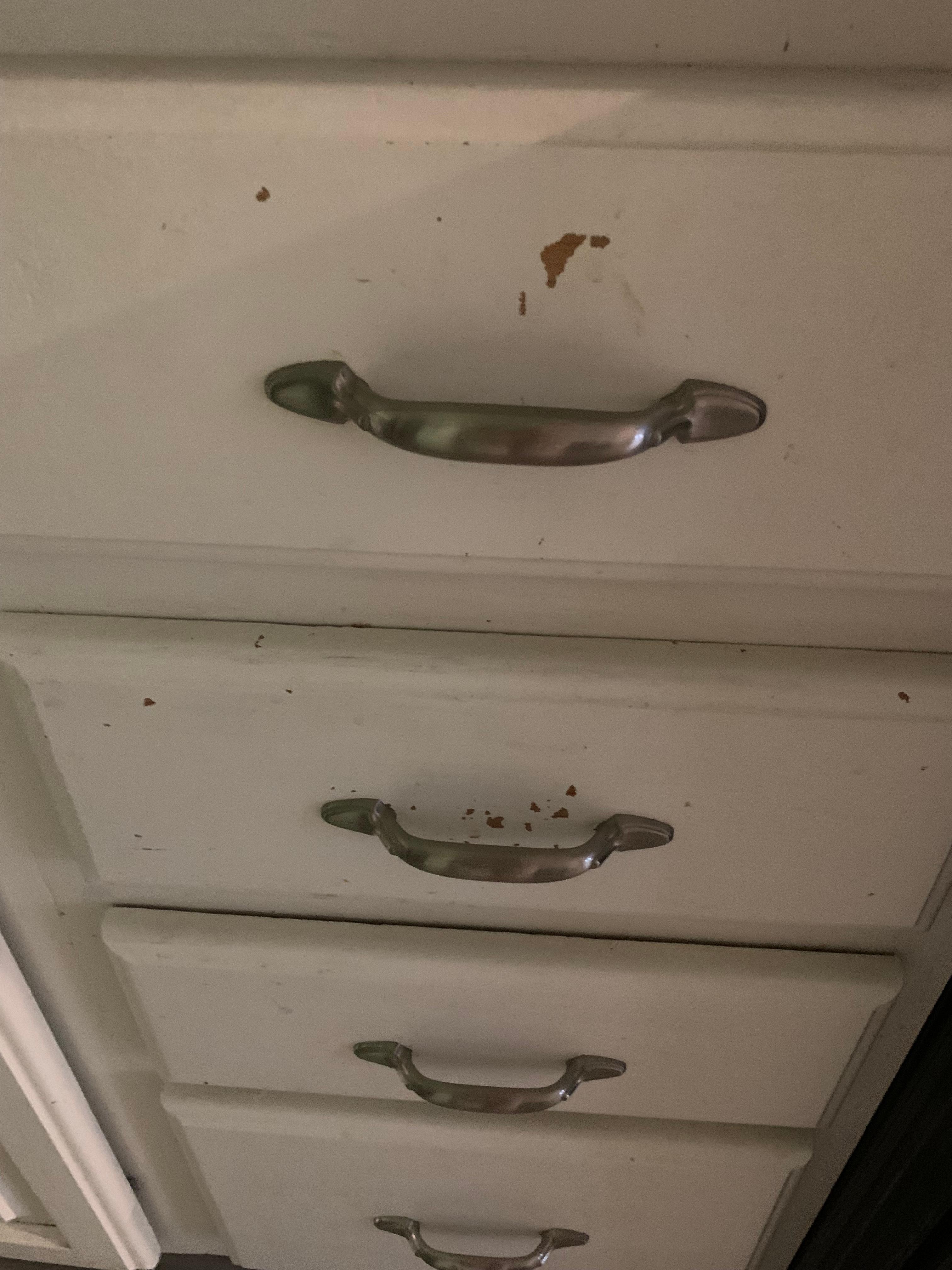 Kitchen drawers with the paint peeling