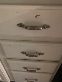 Kitchen drawers with the paint peeling