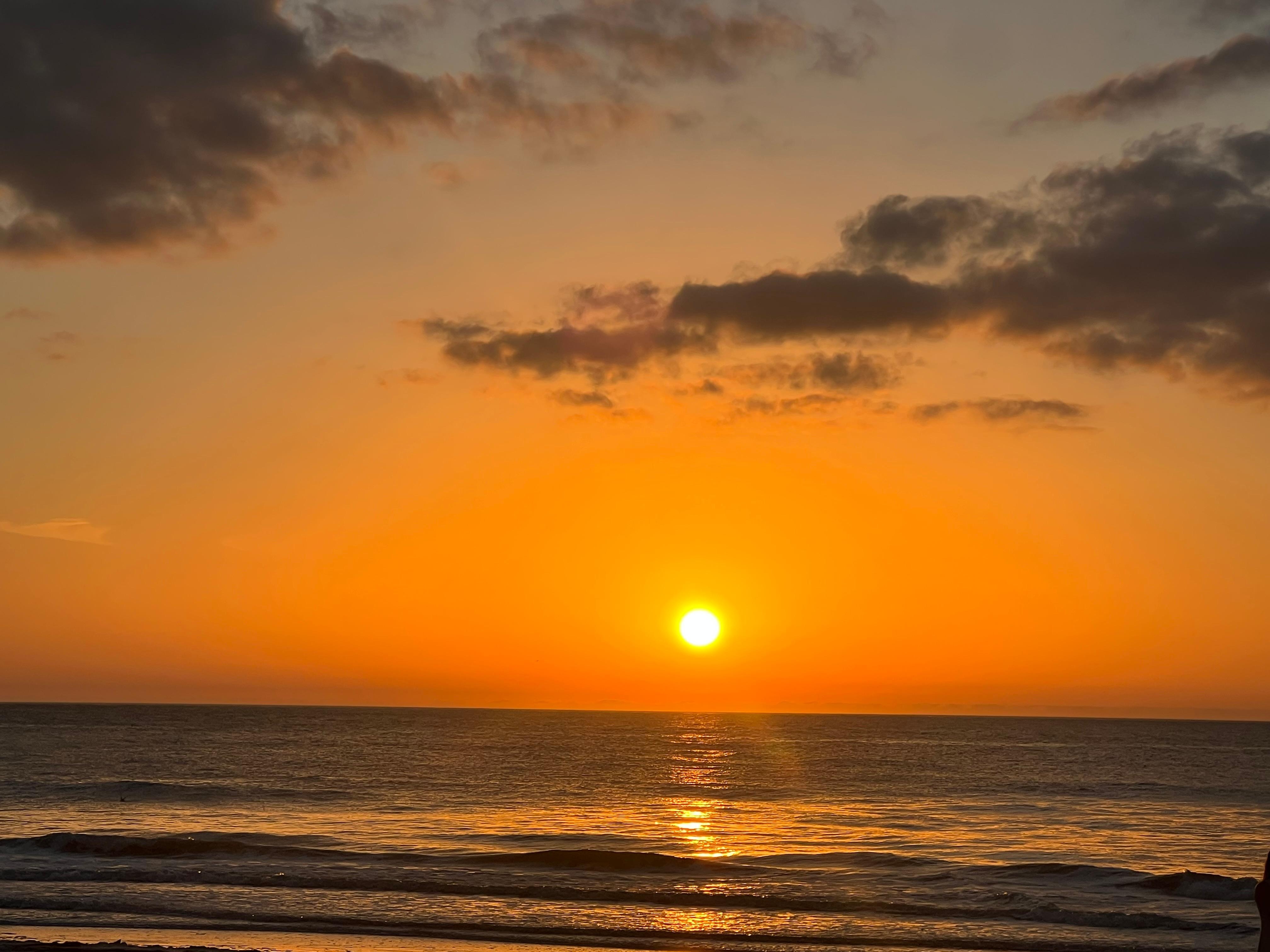 View from the beach in front of condo at sunset