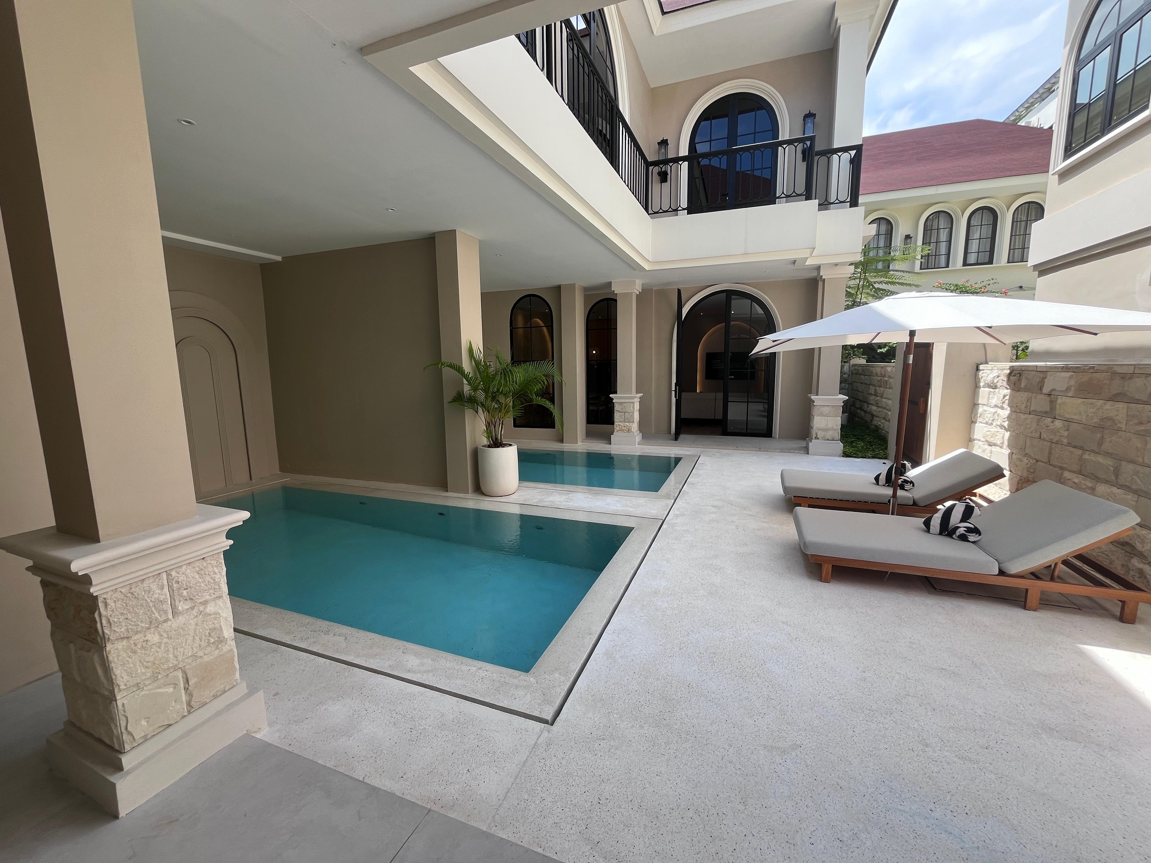 The two units are joined by this courtyard with two pools!