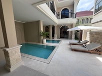 The two units are joined by this courtyard with two pools!
