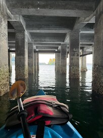 Kayaking under pier.