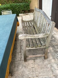The old wooden bench is wobbly and the end comes off.