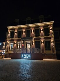 The front of this beautiful hotel at night