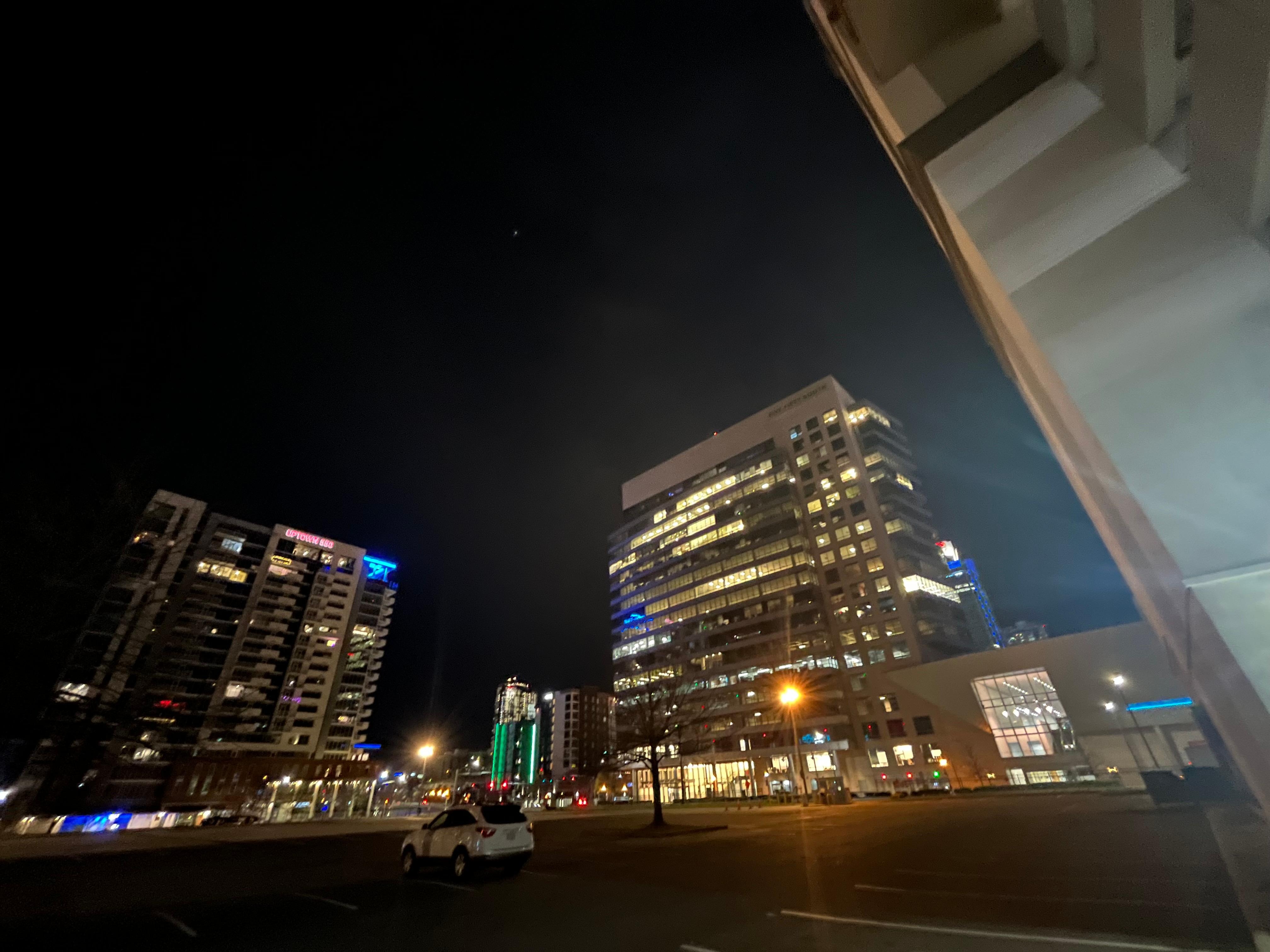 Empty parking lot adjacent to hotel property