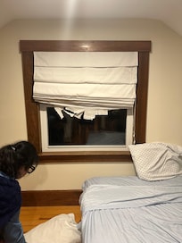 Blinds falling apart bed on floor