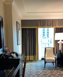 46 in TV, no free water, no bathrobes, Keurig machine available, but no pods or bottled water, no cream or sugar