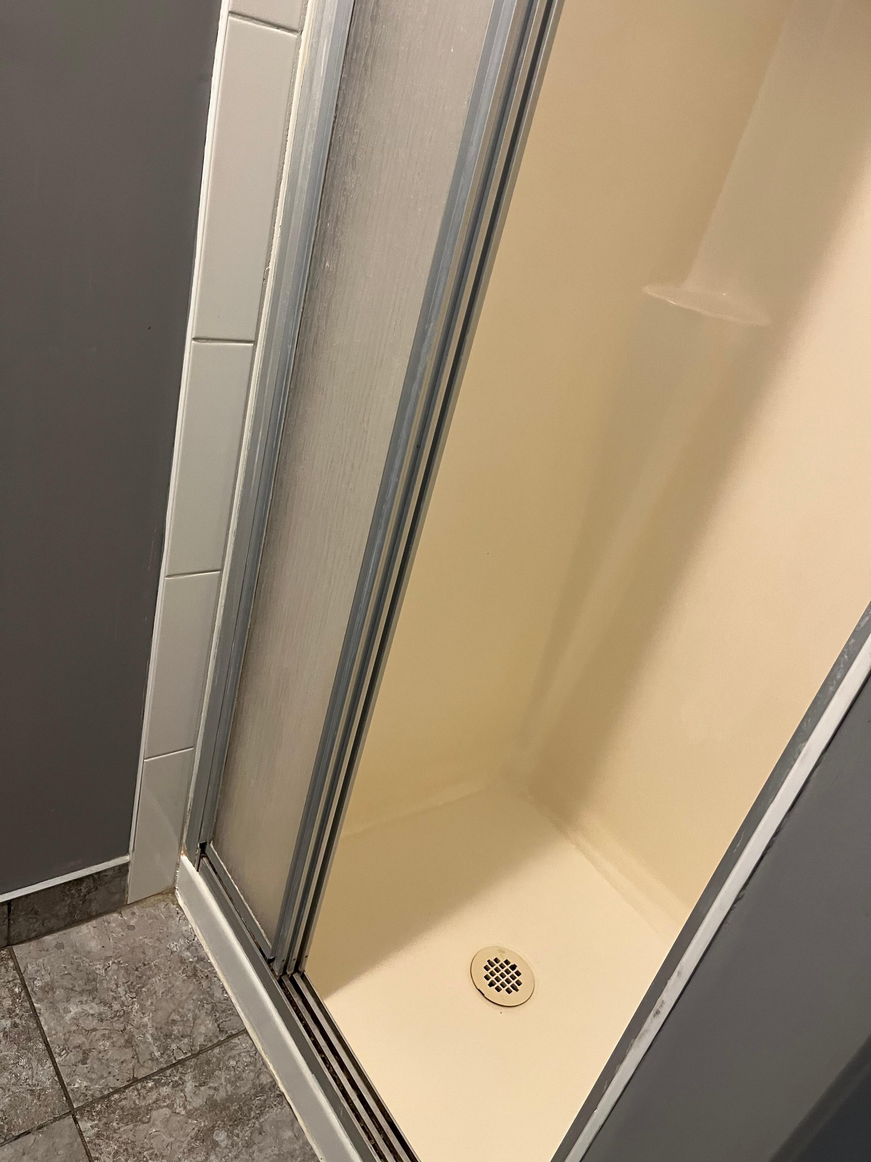 Shower is tiny and a bit outdated, but basically well cared for.