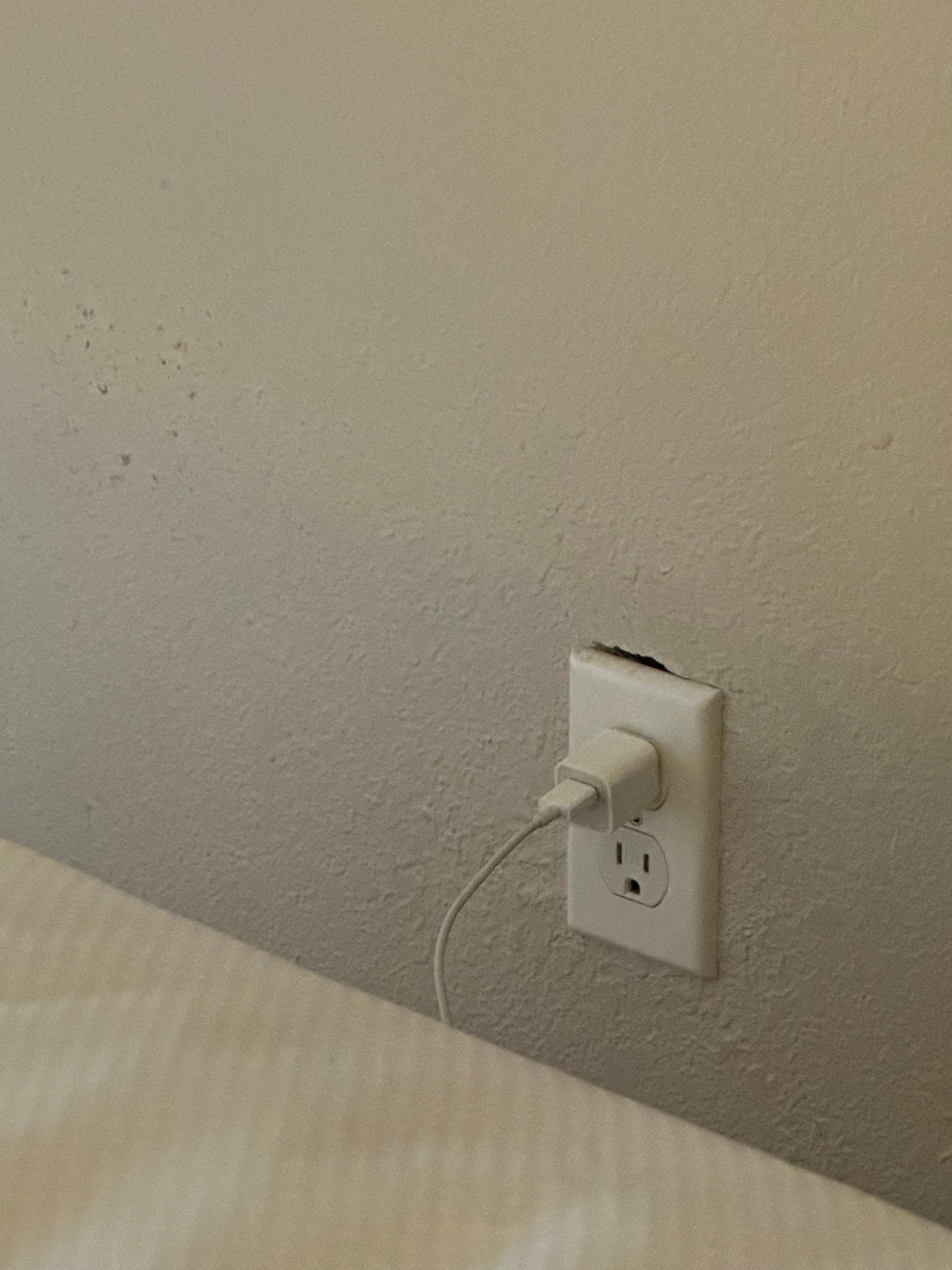 Hole in wall at outlet