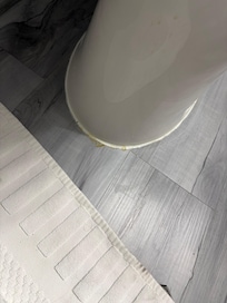 Dried pee around the base of the toilet